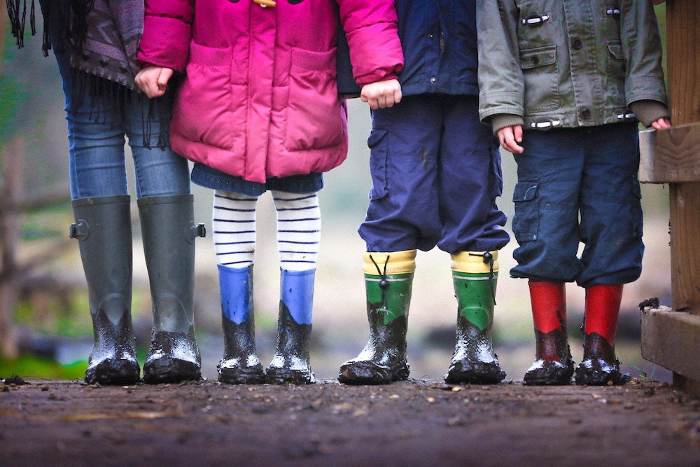 children in mud boots