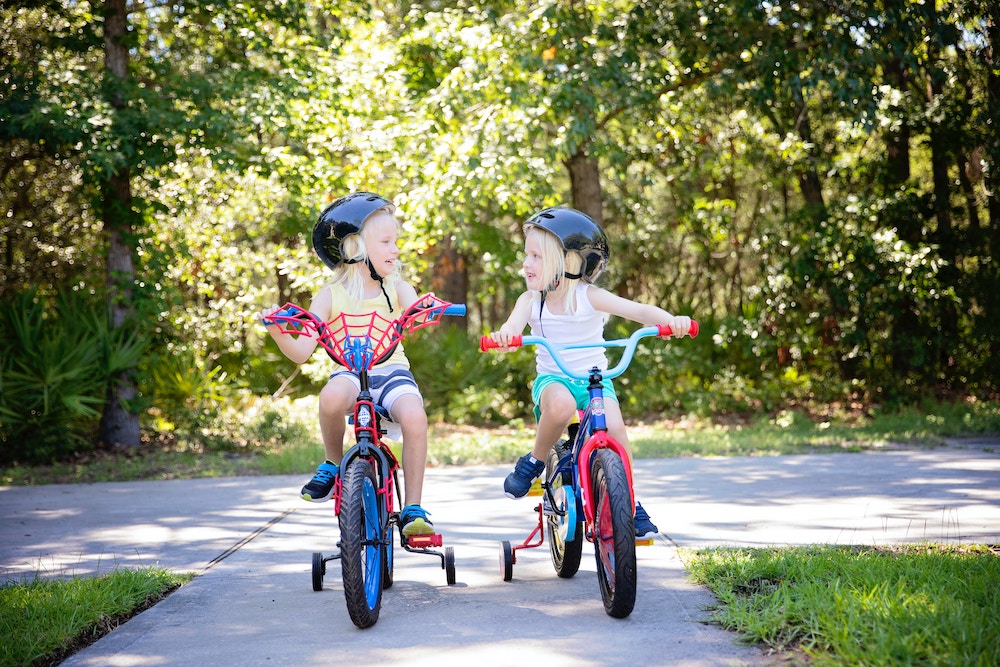 two children practicing bicycle safety